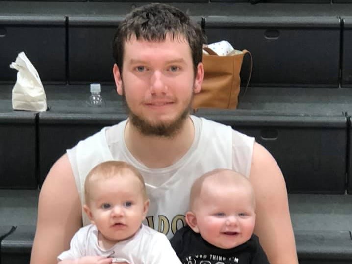 Cannelton Basketball player Rafe Garrett poses with his nephews after scoring his 1,000th point. February 2, 2019.