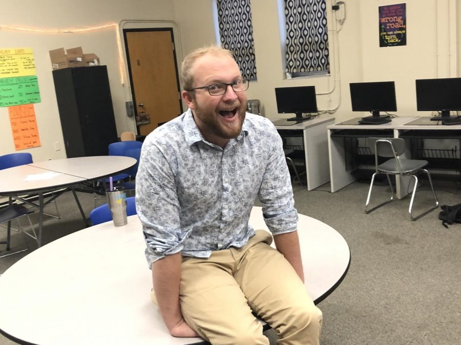 Mr. Parr dons a white and light blue printed tropical shirt.