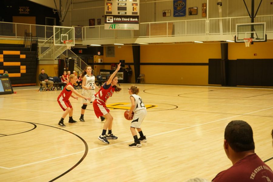 Brianna looking for someone to pass the ball too. 