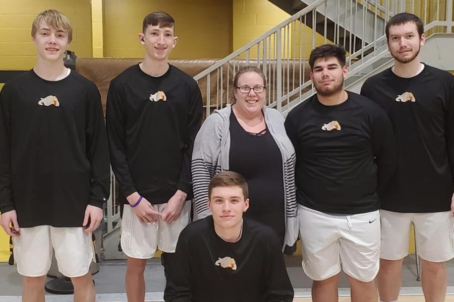 Mrs. Hinton and our senior boys basketball players.